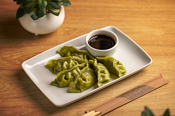 Image showing Platter of steamed Chinese spinach filling dumplings