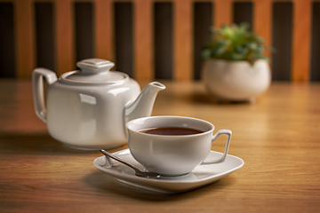 Image showing Herbal tea with white tea cup and teapot