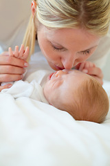 Image showing Closeup, mom and baby with kiss on bed for love, care and bonding in relationship. Infant, sleep or dreaming of hope, future or new life with growth, milestone or child development in family home