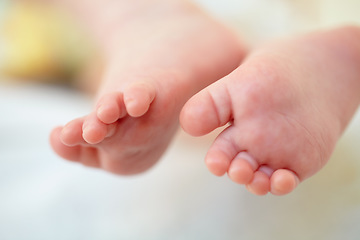 Image showing Closeup, baby and feet for hope in home for future, childhood or development. Infant, toes or growth for milestone with family, care and protection for safety in nursery for wellness, peace or health