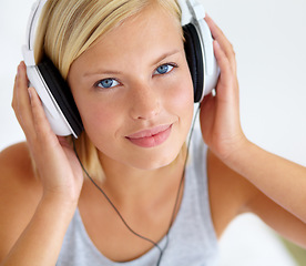 Image showing Portrait, smile and woman with headphones, streaming music and listening to audio with radio, apartment and sound. Face, home and person with a headset, podcast and wellness with peace and hearing