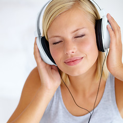 Image showing Home, headphones and woman with music, relax and streaming sound with radio, peace and calm. Zen person, technology or girl with headset, podcast audio and playlist with connection, song and internet