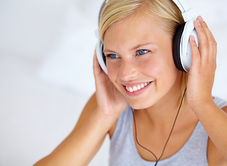 Image showing Home, thinking and woman with headphones, streaming music and smile with radio, podcast and listening to audio. Person, apartment or girl with headset, ideas and happiness with sound, joy or cheerful