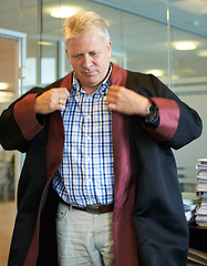 Image showing University, professor and senior man in office with coat for graduation ceremony, teaching and education. College, professional school and mature teacher for academic career, learning and knowledge