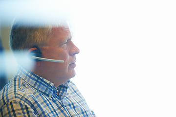 Image showing Businessman, face and headphones at call center for customer service, telemarketing or support at office. Mature man, consultant or agent ready for online advice or help on mockup space at workplace