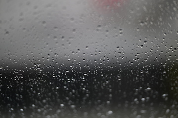 Image showing Water drops on fogged glass with a gray brightness gradient