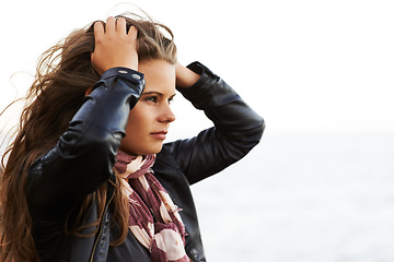 Image showing Face, thinking and regret with a woman outdoor in the fresh air for fashion on a mockup sky background. Travel, idea and daydreaming with a young person outside for trip, adventure or tourism