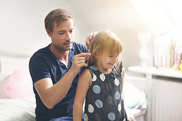 Image showing Father, daughter and helping with hair or happiness on bed in bedroom of home for support and love. Family, man and girl child with smile, hairstyle and haircare for parenting, care and relationship