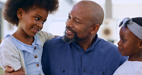 Image showing Home, black family and father with girls, hug and conversation with love, happiness and weekend break. Apartment, dad and children in a lounge, bonding together and joy with vacation, embrace or talk