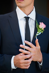 Image showing Man, groom and hands with wedding ring for marriage, commitment or symbol of love, trust or care. Closeup of married male person in suit with flower and jewelry for vow, promise or engagement event