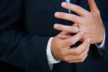 Image showing Man, groom and hands with ring for marriage, commitment or symbol of love, trust or care. Closeup of married male person in suit adjusting jewelry on finger for vow, promise or wedding engagement