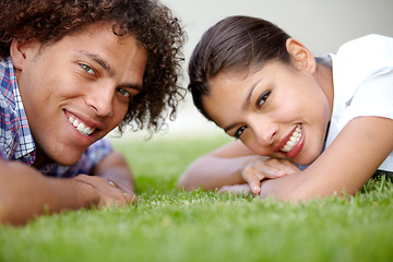 Image showing Love, grass and portrait of couple in nature lying together for bonding, relax and relationship. Dating, happy and face of man and woman in garden for summer picnic on holiday, vacation and weekend