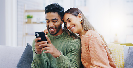 Image showing Couple, living room sofa and texting with phone, smile and click for contact, meme and notification in home. Man, woman and happy with smartphone, reading and app for social network, video and relax