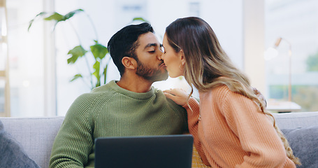 Image showing Couple, love and kiss with laptop on sofa for movies, digital subscription and download multimedia show at home. Happy man, woman and relax at computer for affection, online shopping and connection