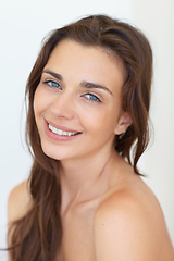 Image showing Portrait, beauty and aesthetic with a young woman in studio on a white background for natural skincare. Face, smile or cosmetics and a happy person looking confident with her antiaging skin routine