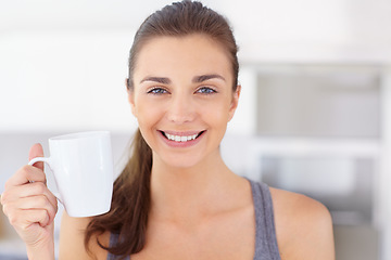 Image showing Portrait, smile and young woman drinking coffee in the kitchen of her home to wake up in the morning. Face, wellness and time off with a happy person in an apartment to enjoy a warm caffeine beverage