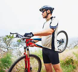 Image showing Sports, bike and fitness with a man in the mountains for cardio training, recreation or a summer hobby. Nature, cycling and freedom with a confident young athlete outdoor for eco friendly exercise