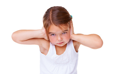 Image showing Portrait, loud and covering ears with a girl child in studio isolated on a white background to stop noise. Face, stress or sound with an unhappy young kid using her hands to block hearing for silence