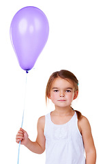 Image showing Portrait, children and balloon with a girl in studio isolated on a white background at a birthday celebration. Kids, face and party with an adorable young child looking serious at a milestone event