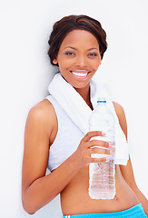 Image showing Black woman, exercise and water with portrait and smile from sport, workout and training in studio. Happy, healthy and African female athlete with wellness and drink after gym with white background
