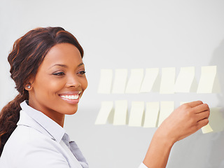 Image showing Business woman, smile and sticky note on board for planning, vision and thinking for solution at company. African entrepreneur, happy and glass with problem solving process for project management