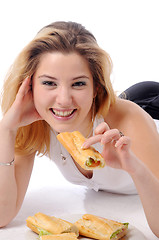 Image showing Young pretty eating girl