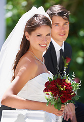 Image showing Wedding, portrait and bride and groom with flowers for love, celebration or union, ceremony or romance. Commitment, marriage and face of couple outside with support, trust and security or life event