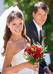 Image showing Happy couple, portrait and wedding with bouquet of roses for love, care or just married at outdoor ceremony. Face of bride and groom smile for marriage, engagement or commitment together with flowers