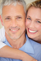 Image showing Happy couple, face and portrait hug for love, support or care in romance together on holiday weekend at home. Closeup of mature woman, man smile or hugging in embrace, bonding or honeymoon at house