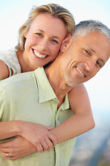 Image showing Happy couple, portrait and hug for love, care or romance together on holiday, vacation or outdoor weekend. Face of mature married woman hugging man with smile in embrace, bonding or honeymoon getaway