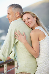 Image showing Happy couple, hug and love on balcony in marriage, embrace or care on honeymoon together. Married female person hugging fiance with smile in relax for support, trust or commitment on romantic getaway