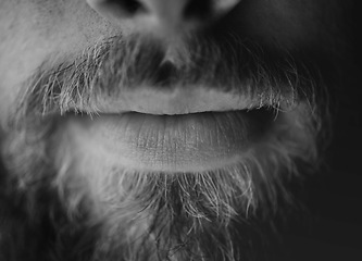 Image showing Man, beard and lips closeup with a face in monochrome for creativity and art with facial hair. Black and white, serious male person and moustache with mouth and creative with grooming and treatment