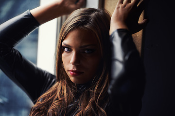 Image showing Portrait, beauty and feminine with a confident woman in the bedroom of her home for fashion or style. Dark, face and natural with a young person alone in her apartment to relax in the evening