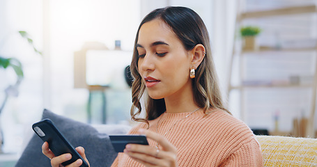 Image showing Phone, credit card and woman on a sofa with ecommerce, sale or bank, loan and payment in her home. Smartphone, app and female person in a living room for online shopping, code or password for sign up