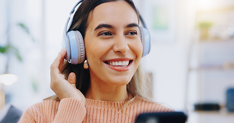 Image showing Woman, phone and smile with headphones in home for listening to audio, radio and podcast. Face, happy girl and smartphone for streaming music, media subscription and thinking of sound on mobile app