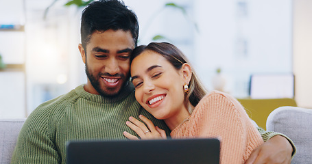 Image showing Couple, laptop and relax on sofa in home living room with smile, hug and watch movie together on web. Man, woman and happy with computer for streaming subscription, show or film with embrace on couch