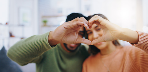 Image showing Heart, hands and couple in home with love, care and support of trust, gratitude and romantic icon. Closeup of man, woman and emoji sign for peace, hope and loyalty of kindness, respect or anniversary