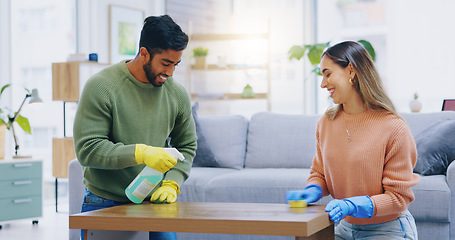 Image showing Couple, spray and cleaning in home of table, furniture and disinfection of dust, dirt or risk of bacteria. Happy man, interracial woman and bottle of chemical detergent to wipe surface in living room