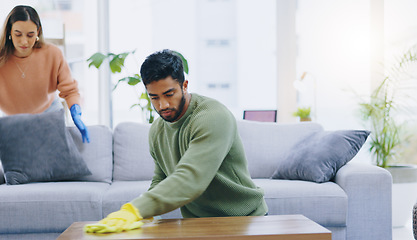 Image showing Couple, spring cleaning and gloves in home living room with teamwork for dirt, dust and bacteria with cloth. Man, woman and helping hand for furniture, hygiene and shine on wood with safety in house