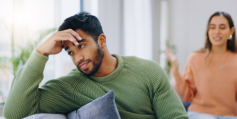 Image showing Couple, home and fight on sofa, sad and angry with stress, mental health and headache with relationship crisis. Man, woman and together on lounge couch with conflict, anxiety and mistake in marriage