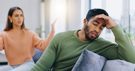 Image showing Couple, home and fight on couch, sad and angry with stress, mental health and headache with relationship crisis. Man, woman and questions on lounge sofa with conflict, anxiety and mistake in marriage