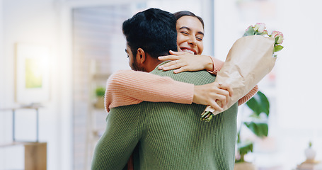 Image showing Man, woman and hug with bouquet of flowers for smile, care or love on birthday, anniversary or celebration. Couple, roses and happy for present, gift or surprise for bonding, romance or home together