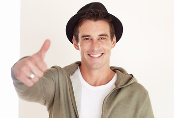 Image showing Portrait, man in studio and thumbs up for fashion, celebrate sales promotion and winning on white background. Happy hipster, deal or emoji for excellence, thank you and yes to feedback for cool style