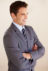 Image showing Business man, arms crossed and happy in studio for thinking, vision and ideas with suit by white background. Entrepreneur, financial advisor or accountant with corporate clothes, smile and fashion