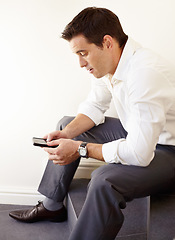 Image showing Business man, phone and stairs in office for reading, thinking and trading with crypto on application. Entrepreneur, investor and check smartphone for stock market, social network or fintech on steps