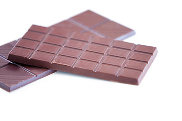 Image showing Chocolate bar, studio candy and sugar sweets for delicious temptation, wellness or tasty dessert treat, cacao slab or snack. Unhealthy junk food, product quality and premium cocoa on white background