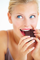 Image showing Eating woman, face and thinking of dark chocolate benefits, antioxidants wellness or morning junk food, calories or tasty candy. Nutrition, delight and person enjoy sugar craving, cacao bar or sweets