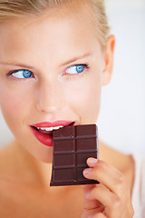 Image showing Eating woman face, thinking and looking at dark chocolate benefits, antioxidants wellness or junk food. Craving solution, taste and girl planning sugar product, cacao bar or sweets advertising plan