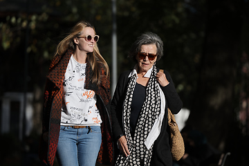 Image showing Elderly old cute woman with Alzheimer's very happy and smiling when eldest daughter hugs and takes care of her