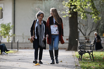 Image showing Elderly old cute woman with Alzheimer's very happy and smiling when eldest daughter hugs and takes care of her